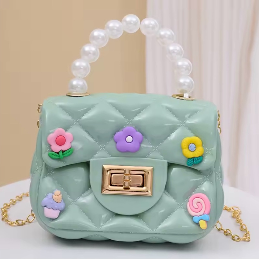Mint Green Quilted Handbag with Pearl Handle and a Gold Plated Shoulder Strap.